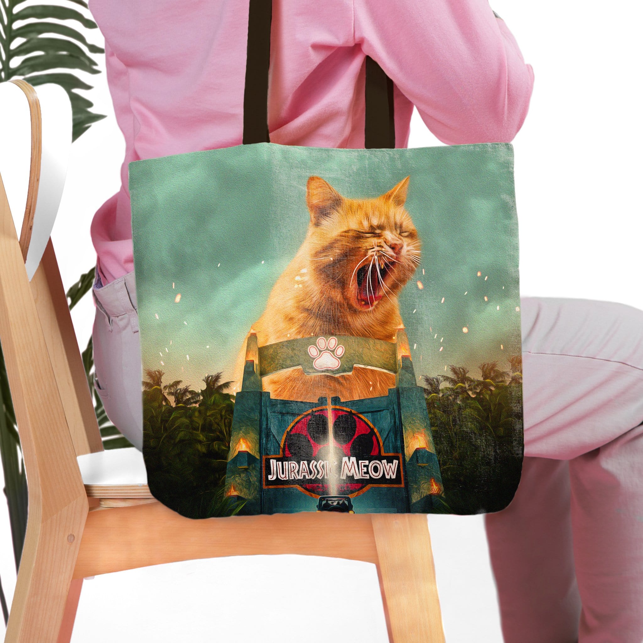Personalized 'Jurassic Meow' tote bag with a custom cat portrait in a Jurassic Park style.