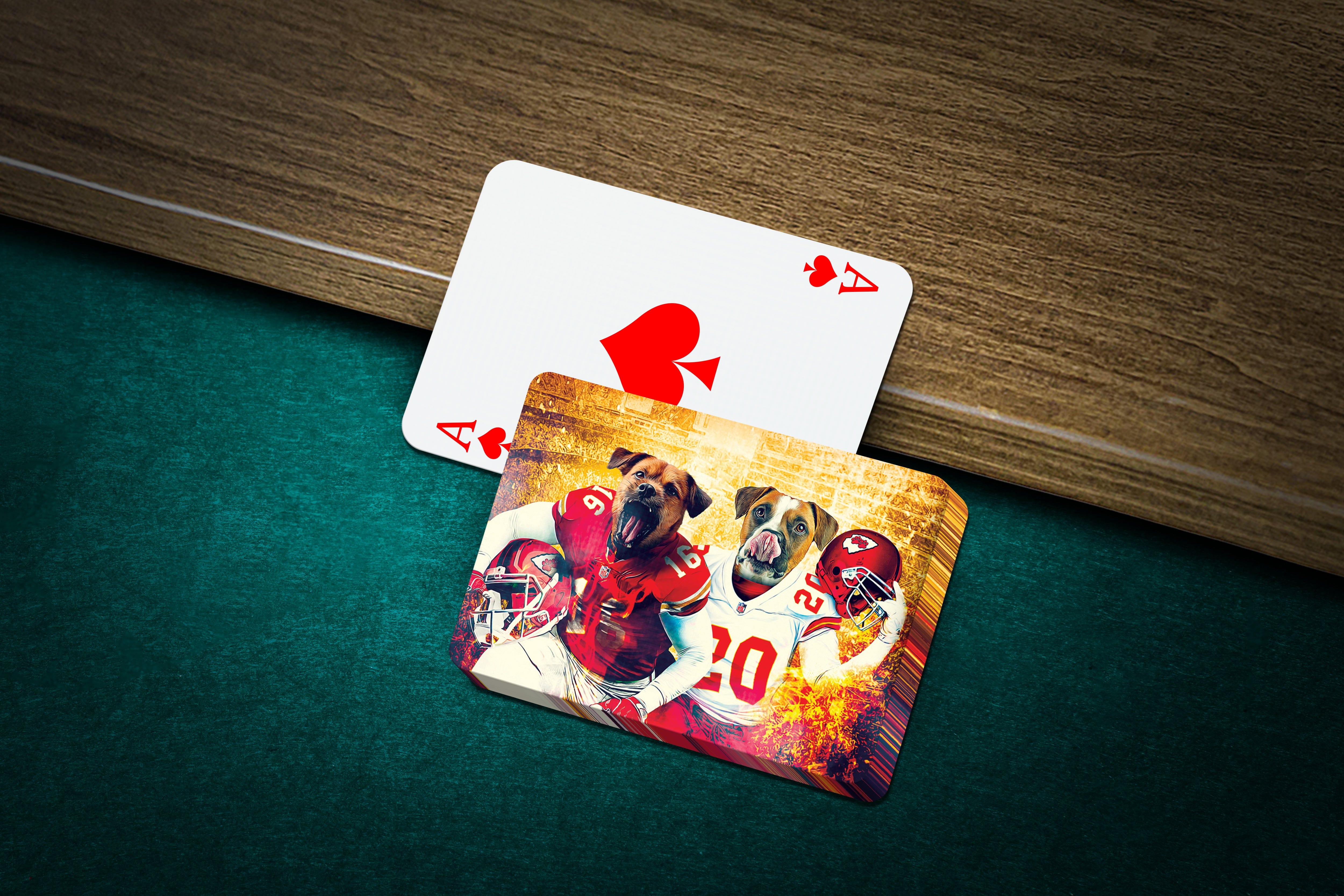 Personalized playing cards featuring two dogs in Kansas City football uniforms, one ace of spades visible.