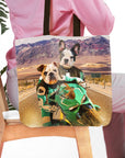 Personalized pet portrait tote bag featuring two dogs on a green motorcycle in a desert landscape.