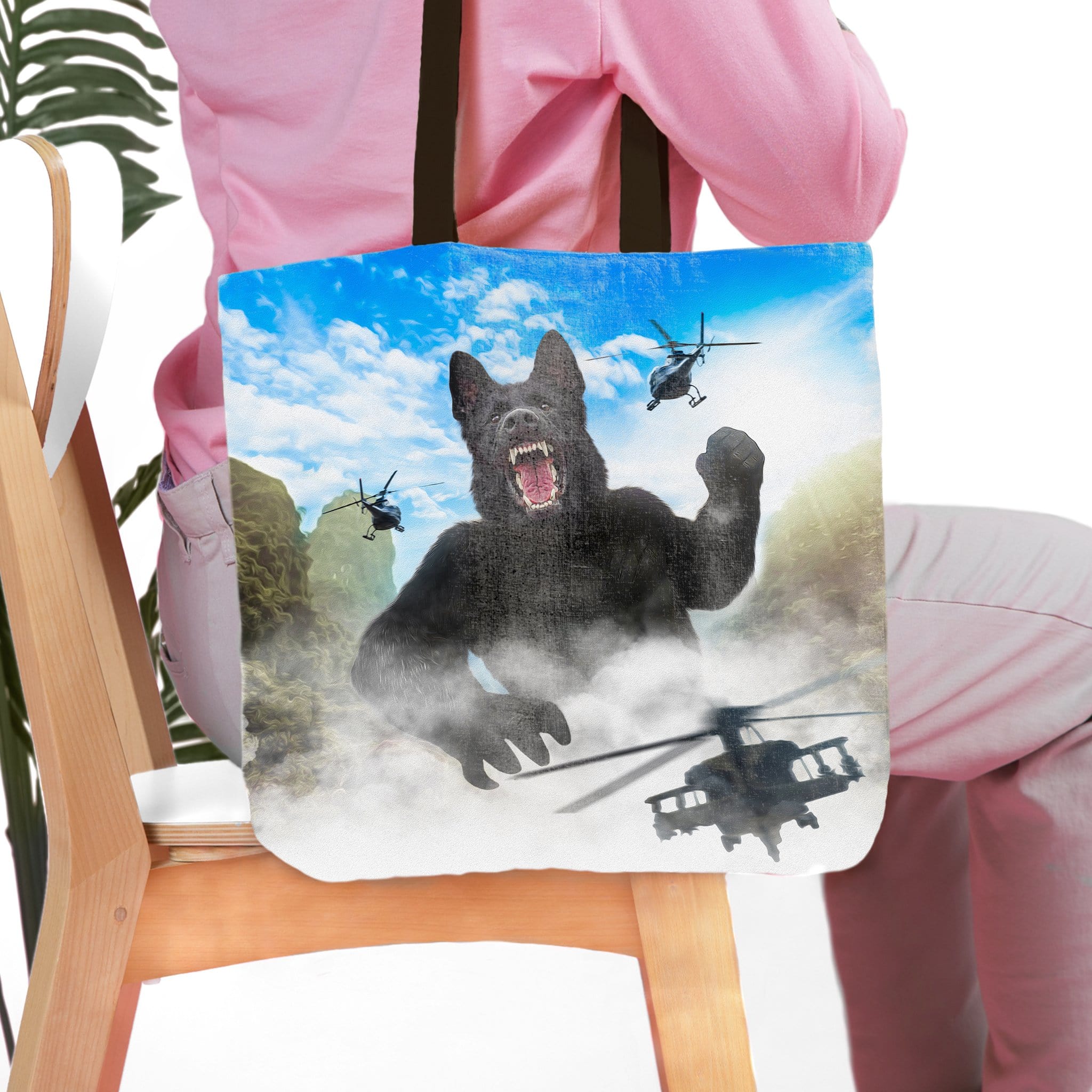 Personalized tote bag with a custom "Kong-Dogg" style portrait of a black German Shepherd and helicopters.
