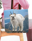 Personalized tote bag with a bulldog pet portrait as a mountain goat on a blue mountain landscape.