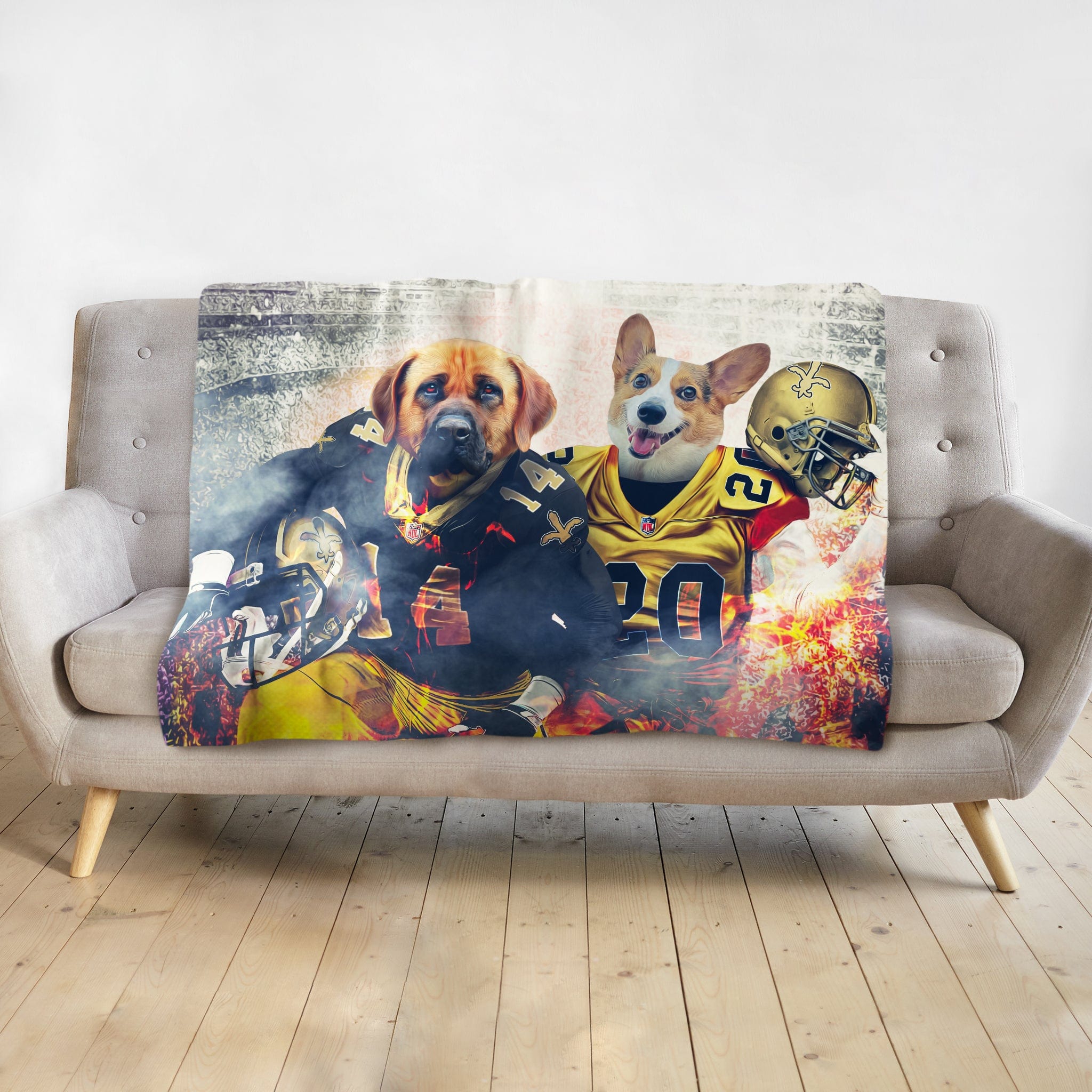 Personalized pet blanket with two dogs in New Orleans Saints football uniforms, on a gray sofa.