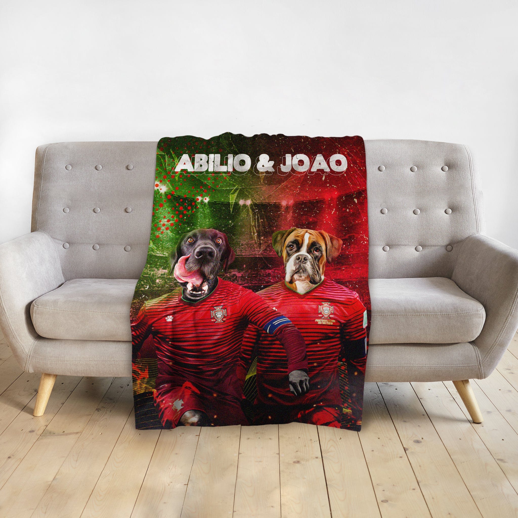 Personalized Portugal Doggos blanket with two dogs in soccer jerseys, named Abilio &amp; Joao, on a sofa.