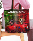 Personalized Portugal Doggos tote bag featuring custom pet portraits of a black lab and boxer in soccer jerseys.