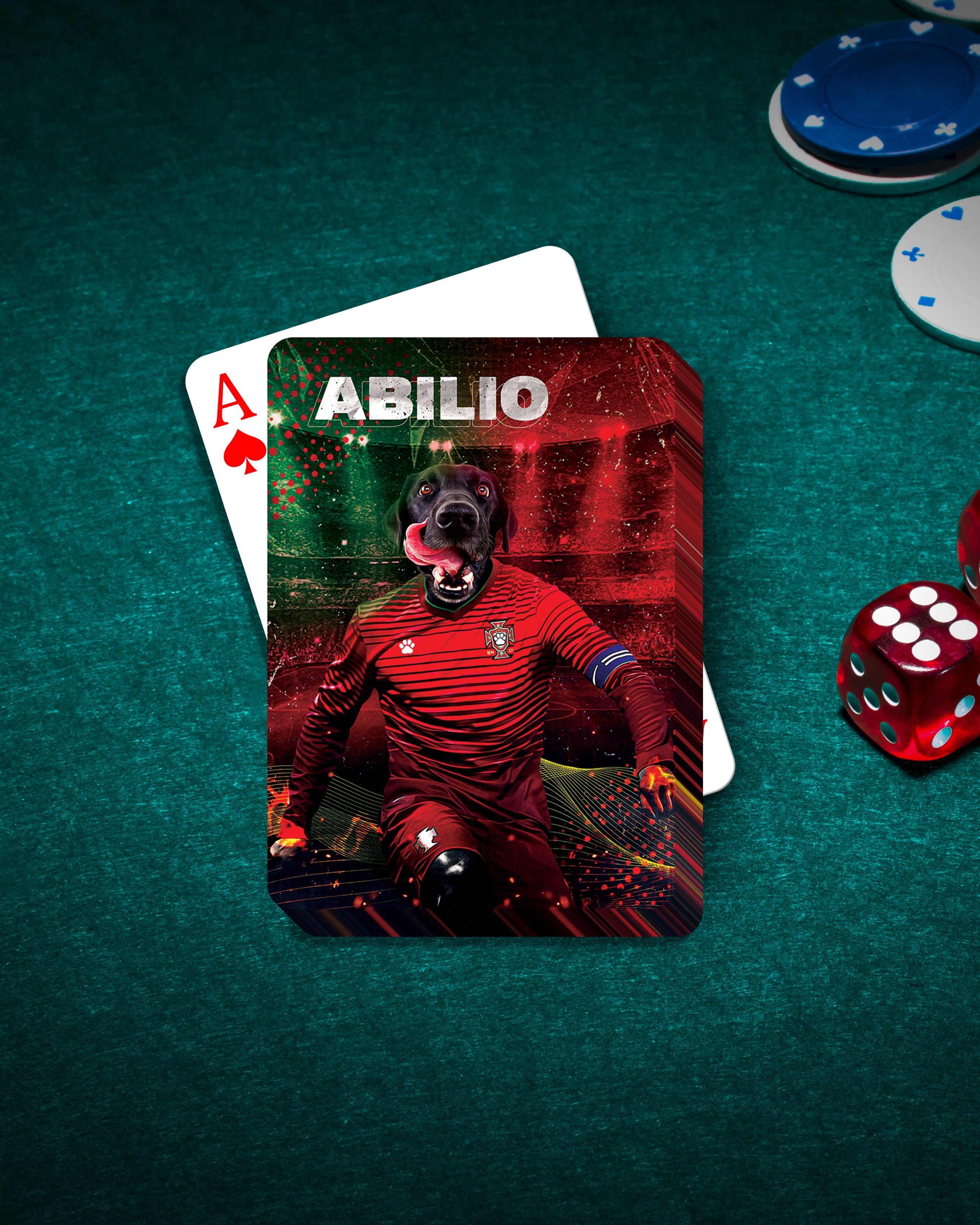 Personalized playing card featuring a black dog in a red soccer uniform, "ABILIO" text, on a green poker table.