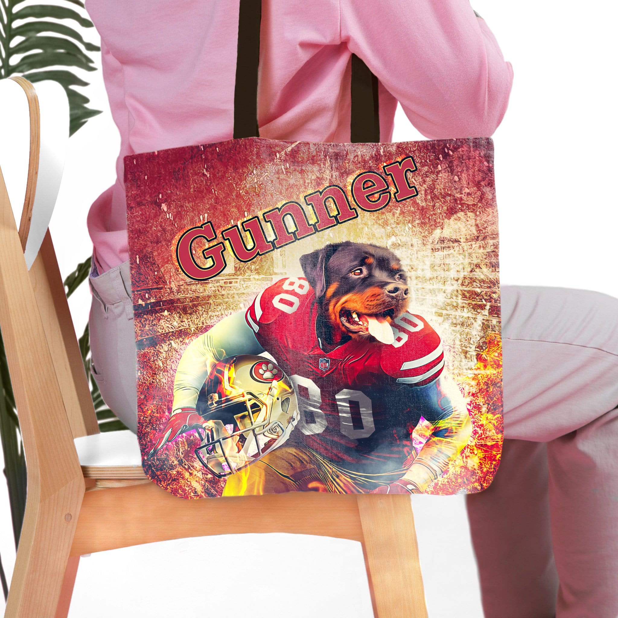 Personalized tote bag with a custom pet portrait of a Rottweiler dog in a football uniform.