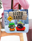 Personalized 'South Bark' 2 pet tote bag featuring custom dog portraits in a snowy landscape.