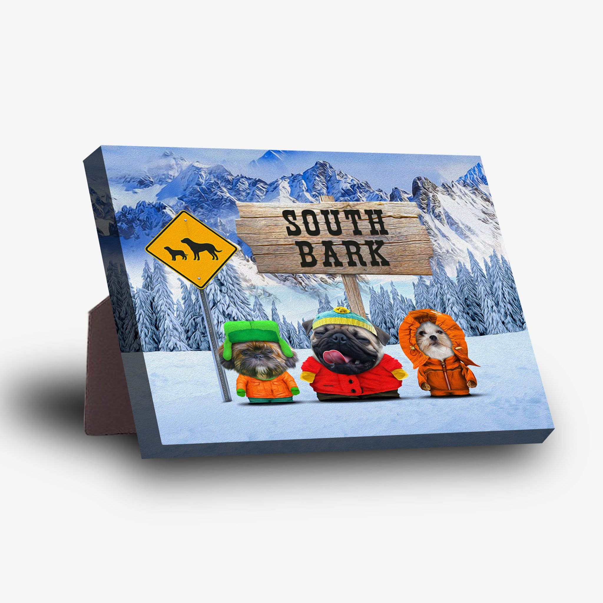 Personalized 'South Bark' standing canvas featuring three pets in winter clothes against a snowy mountain backdrop.