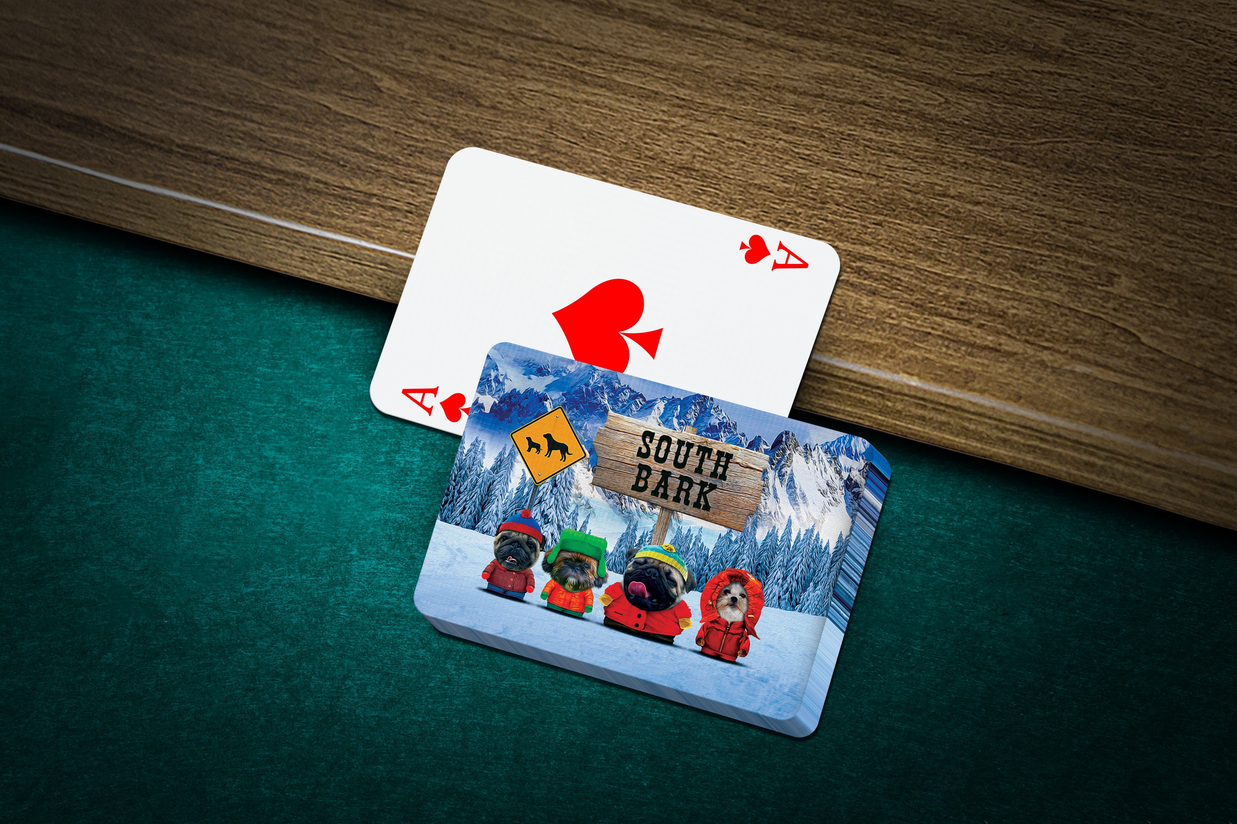 Custom "South Bark" playing cards with four personalized dog portraits in winter gear, next to an Ace of Spades.