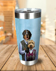 Personalized stainless steel tumbler with two custom dog portraits in argyle sweaters on a light blue background.