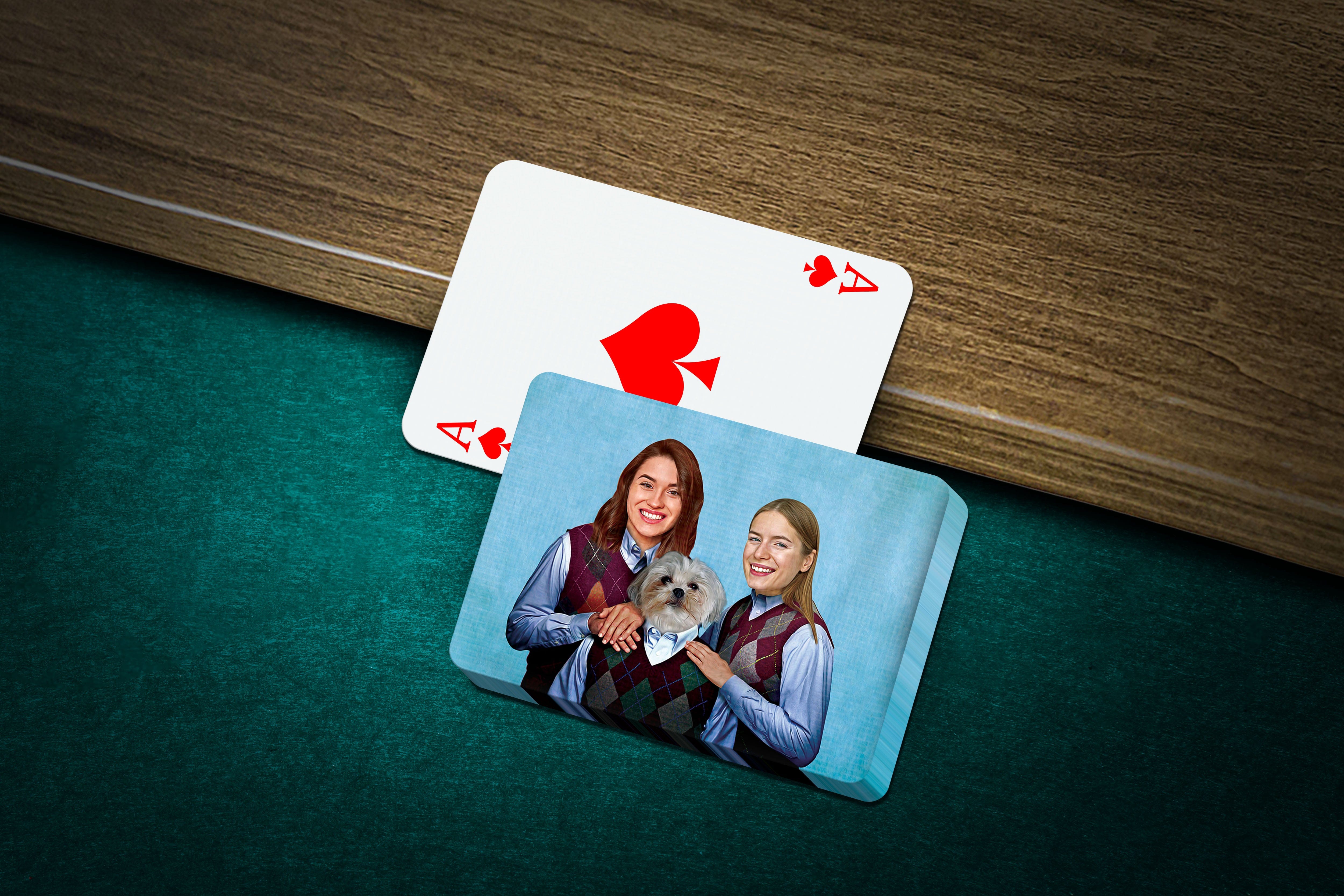 Personalized playing cards featuring a custom portrait of two women and a dog on a blue card.