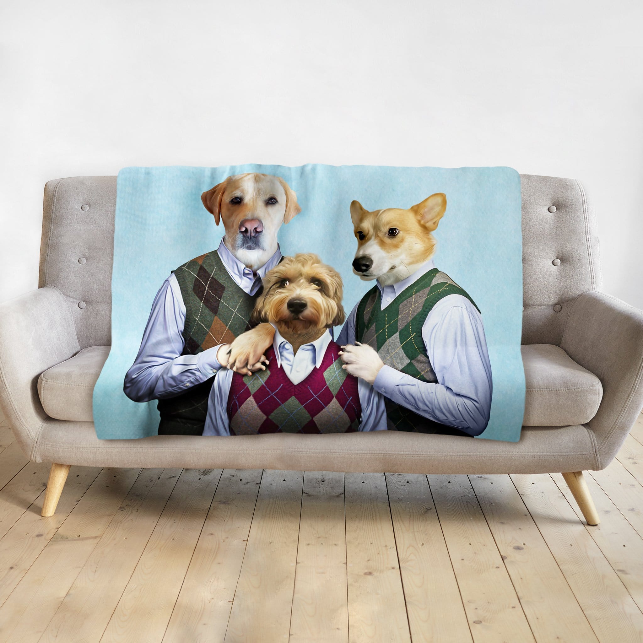Personalized light blue blanket with three dogs in renaissance-style argyle sweater vest portraits.