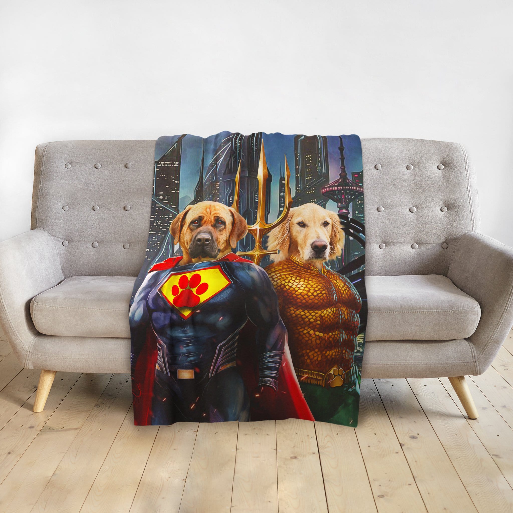 Personalized Superdog & Aquadog pet portrait blanket with two dogs in superhero costumes on a gray couch.