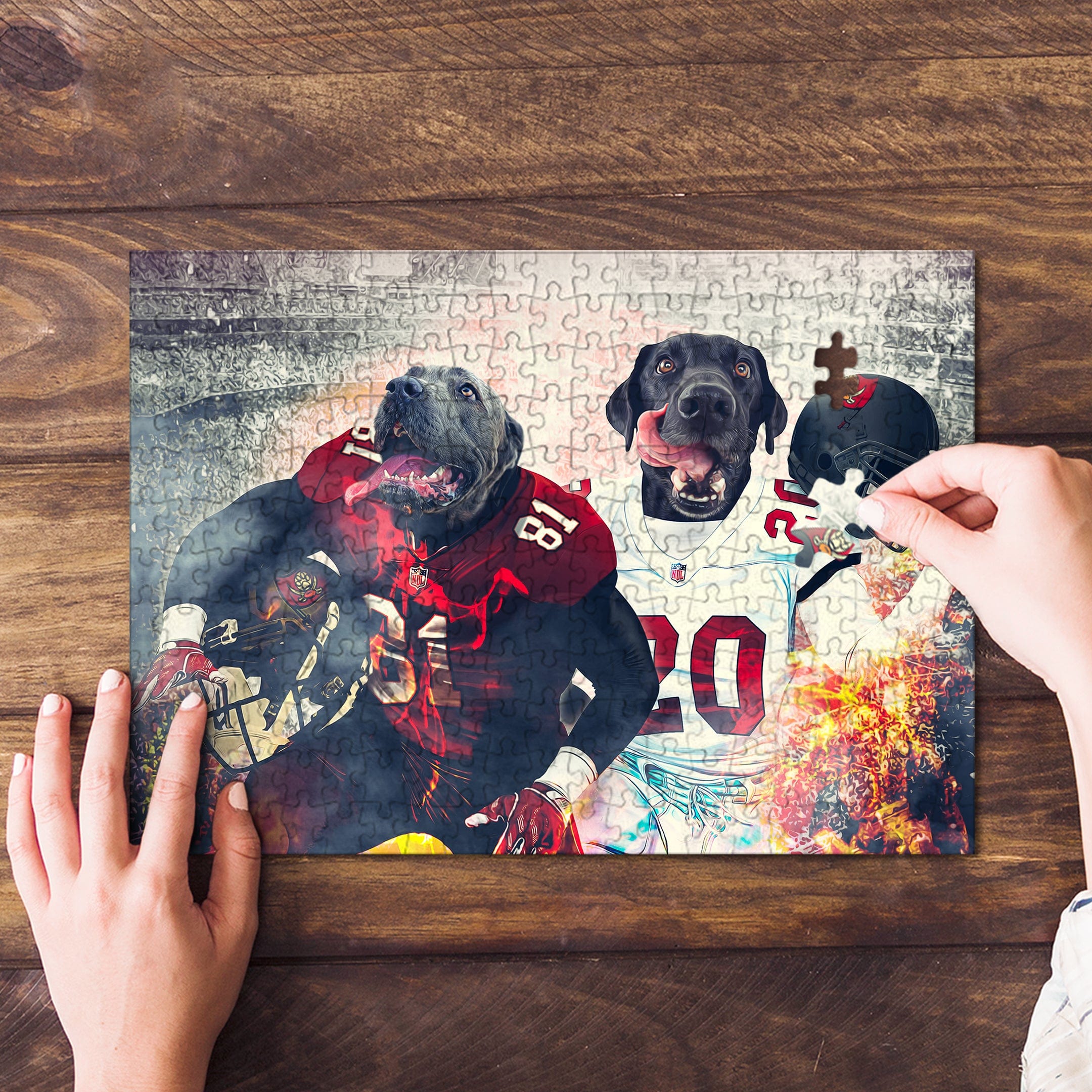 Personalized 2-pet puzzle featuring dogs in football uniforms, being assembled on a wooden surface.