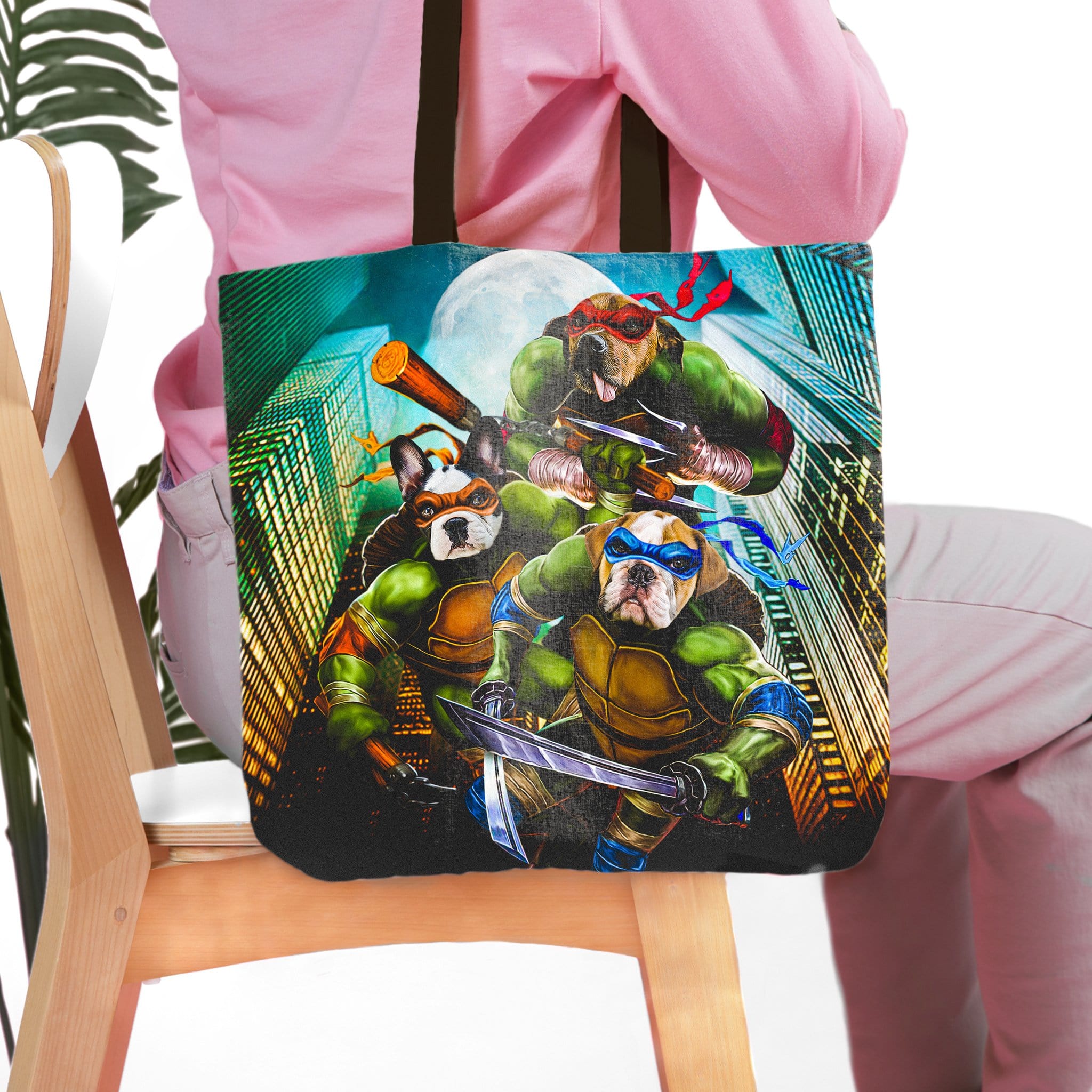 Personalized 3-pet tote bag with cartoon "Teenage Mutant Ninja Doggos" portrait on a city background.
