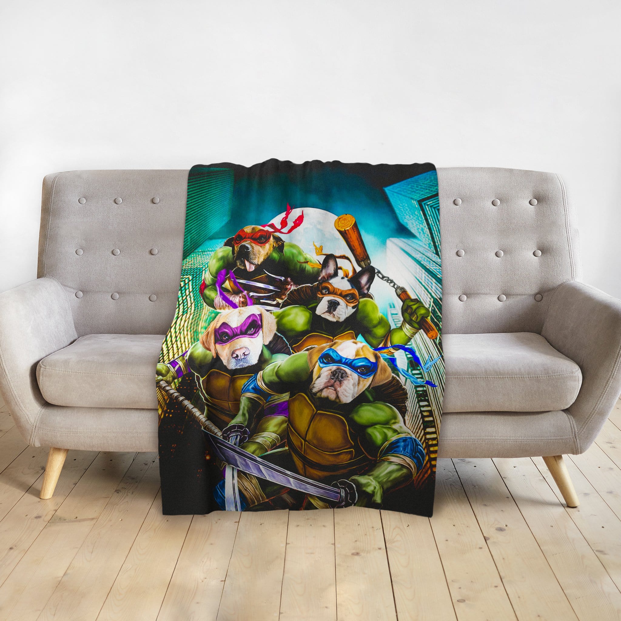 Personalized 4-pet blanket with dogs as Teenage Mutant Ninja Turtles, draped on a gray sofa.
