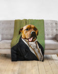 Custom pet portrait blanket featuring a dog in a renaissance-style suit, draped over a gray couch.