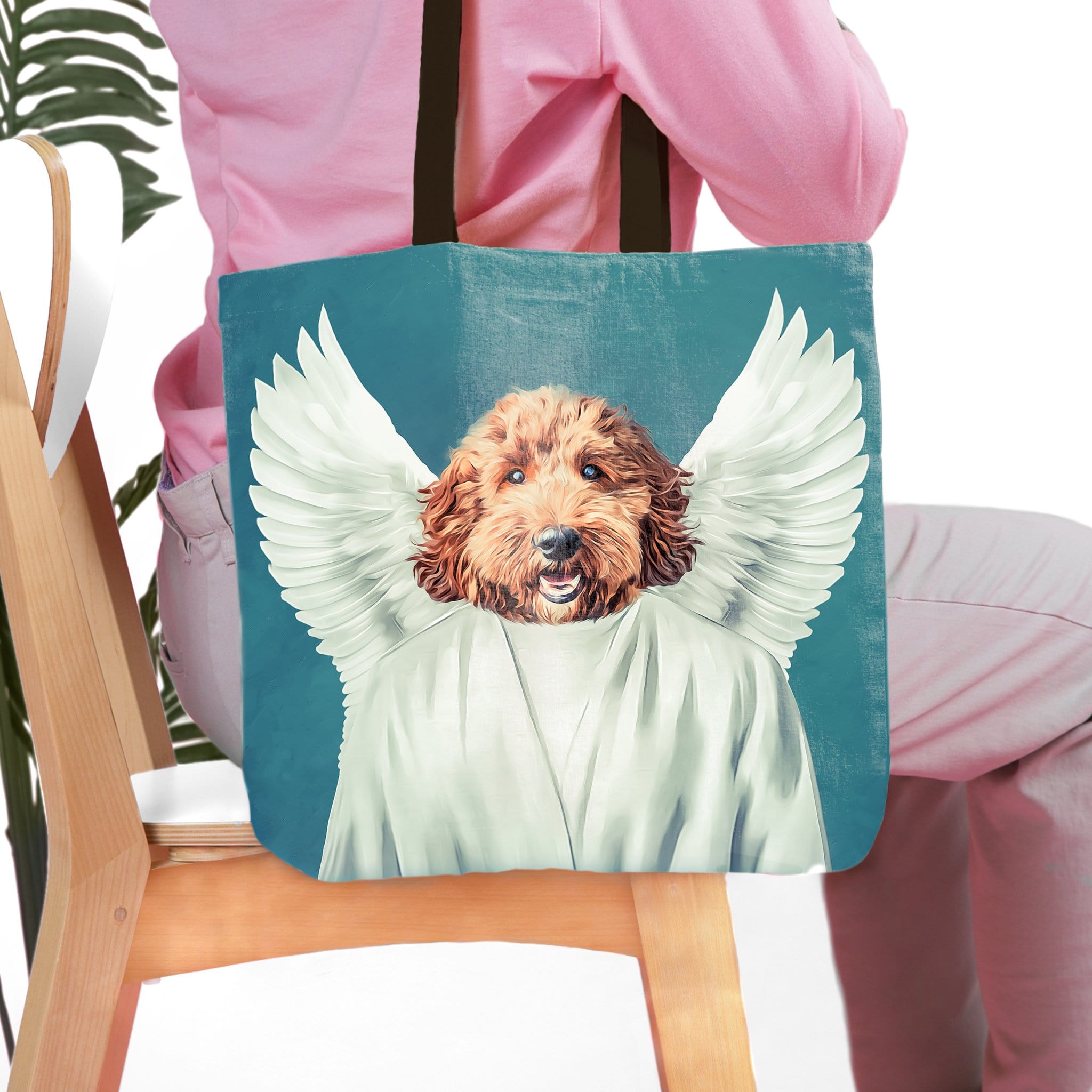 Personalized tote bag with a custom pet portrait of a dog as an angel on a blue background.