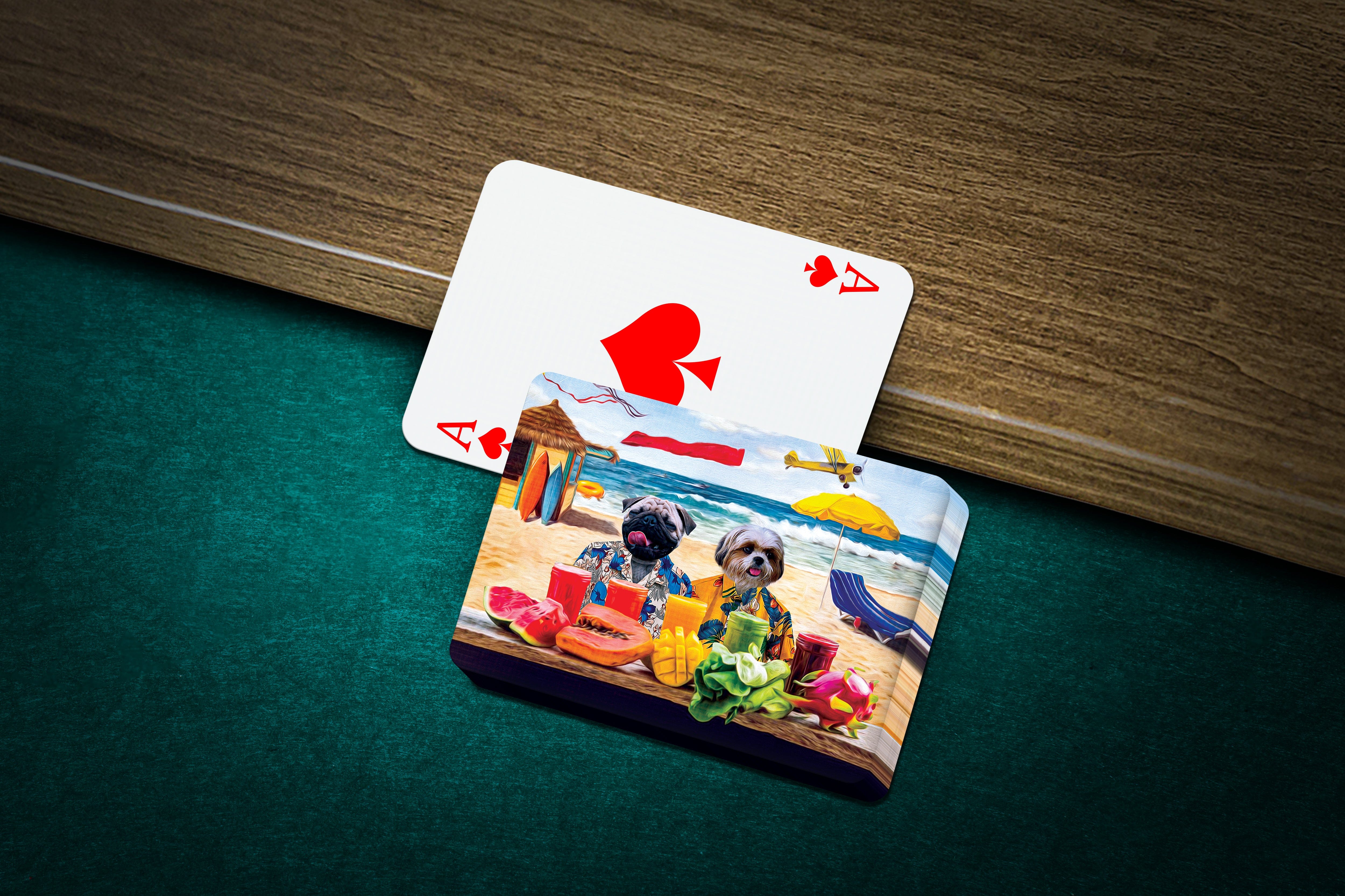 Personalized playing cards featuring two dogs in a "Beach Dogs" cartoon style on a green felt table.