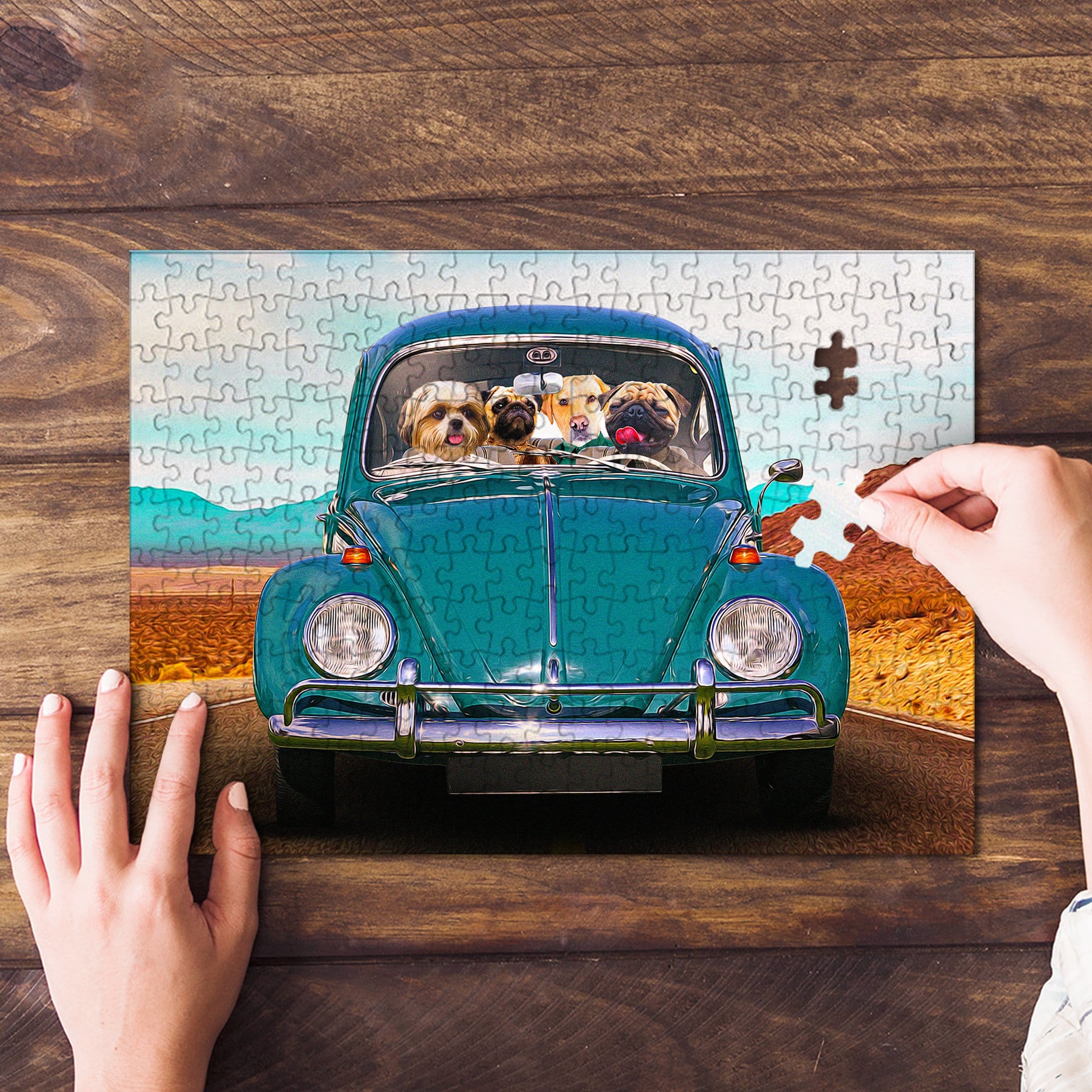 Personalized 4-pet puzzle featuring dogs in a teal Beetle car, with a hand placing a piece.