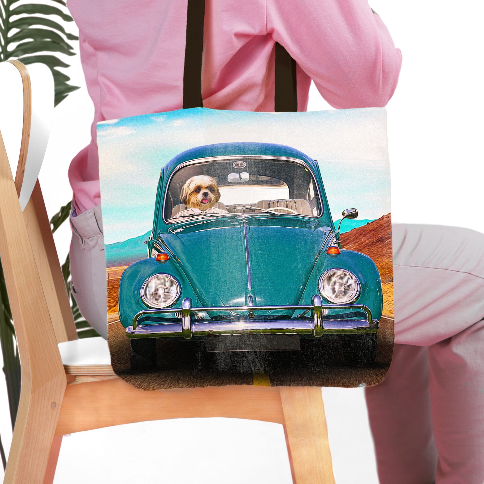 Personalized pet portrait tote bag featuring a dog driving a teal vintage Beetle car.