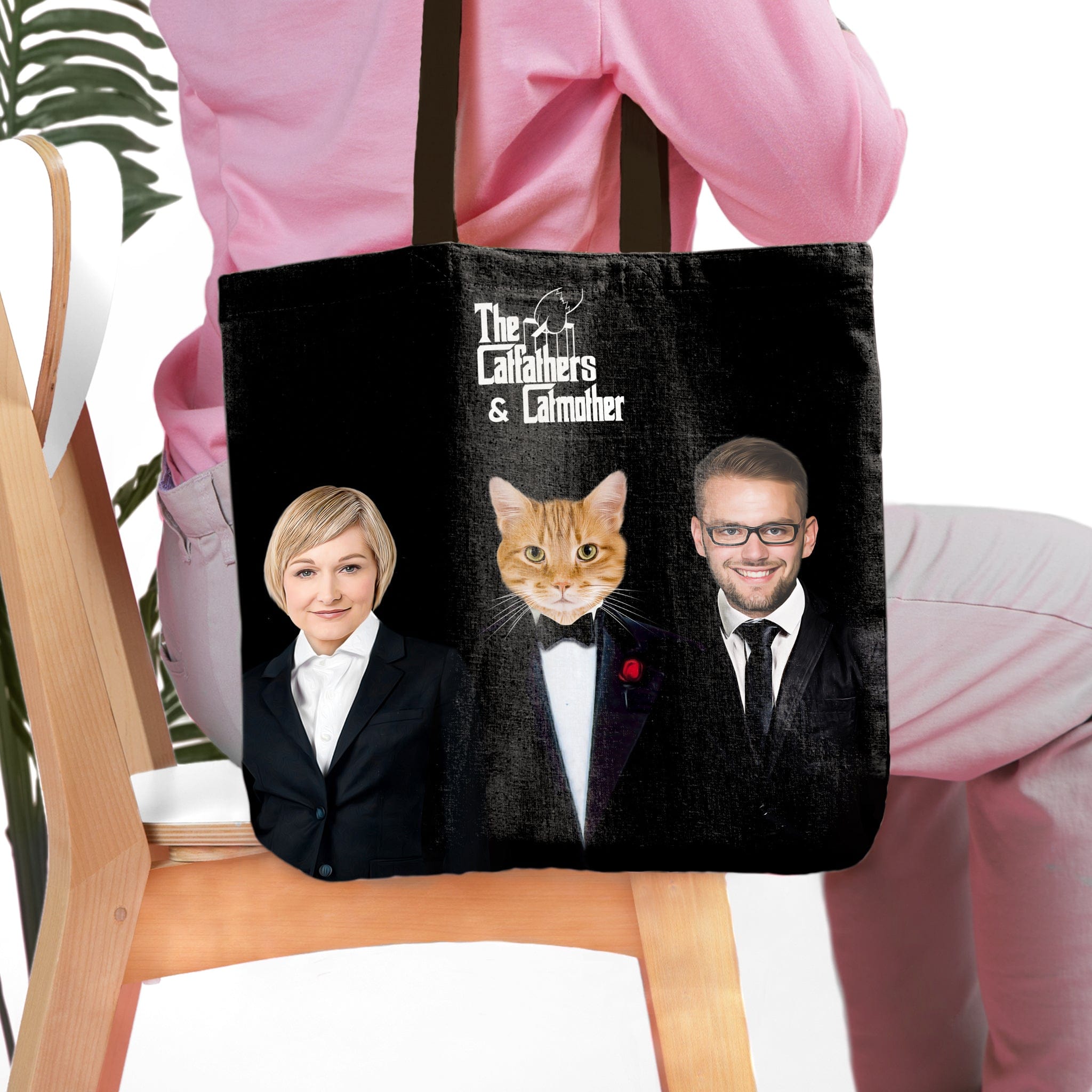 Personalized black tote bag with "The Catfathers & Catmother" text and custom pet and owner portraits.