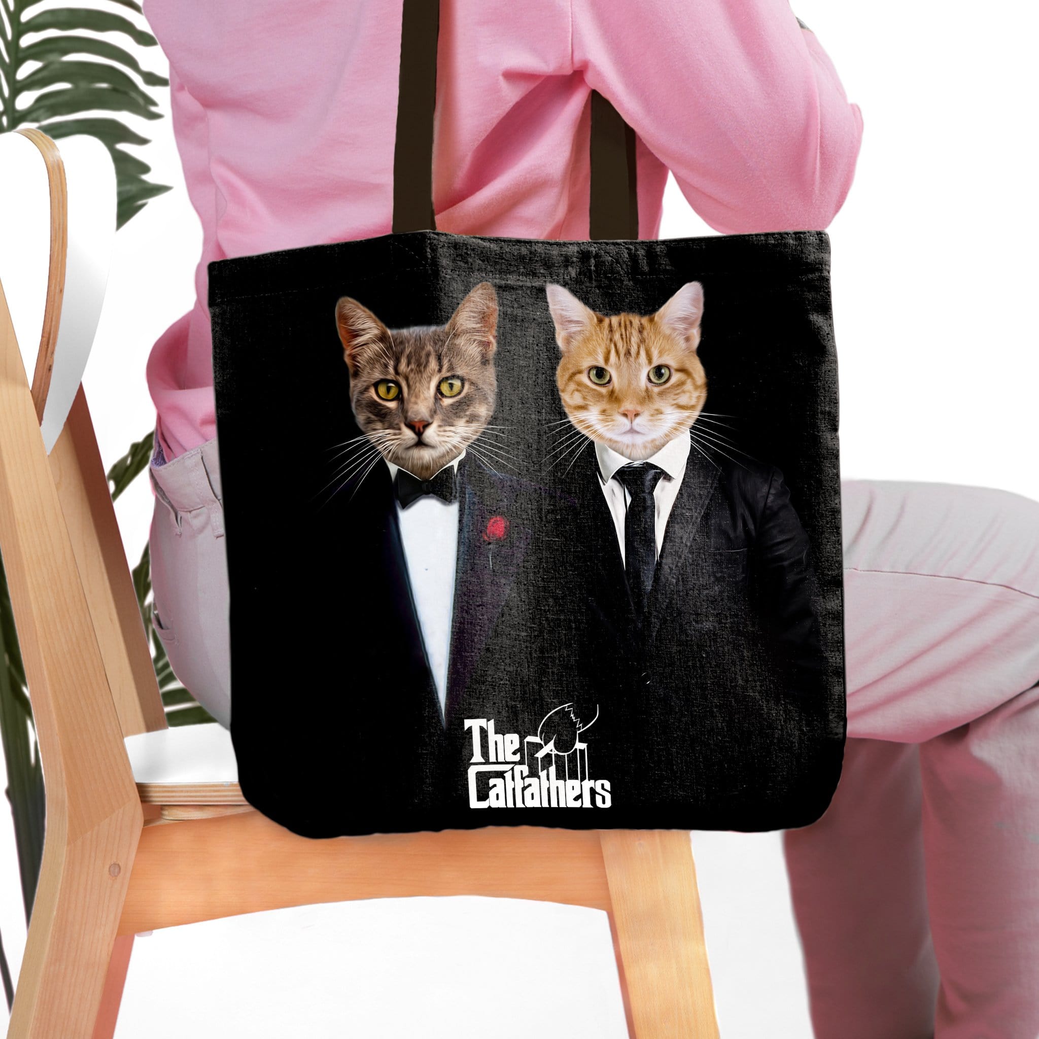 Personalized black tote bag with two custom cat portraits in "The Catfathers" suits.
