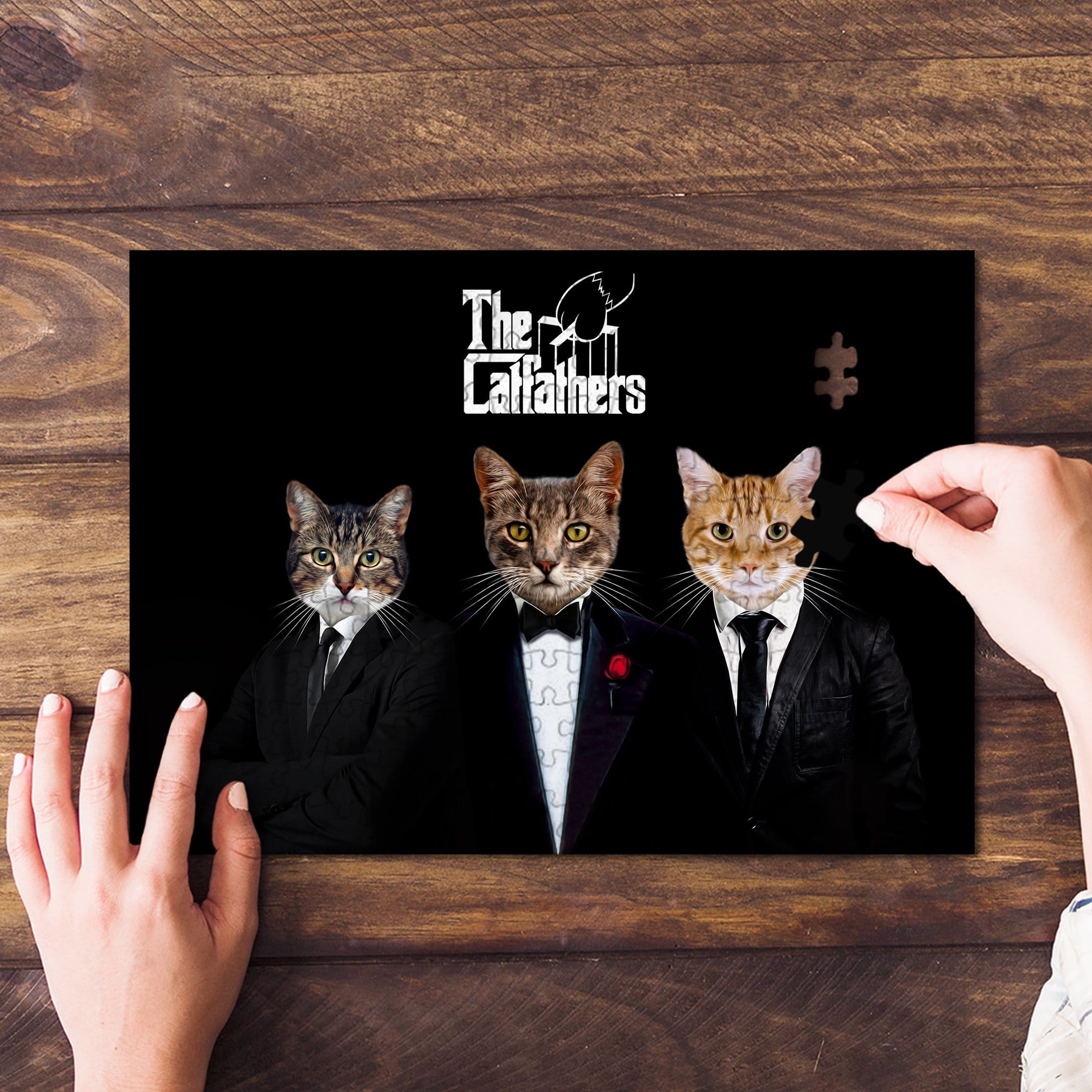 Personalized 3-pet "The Catfathers" puzzle with three cats in suits, one piece being placed.