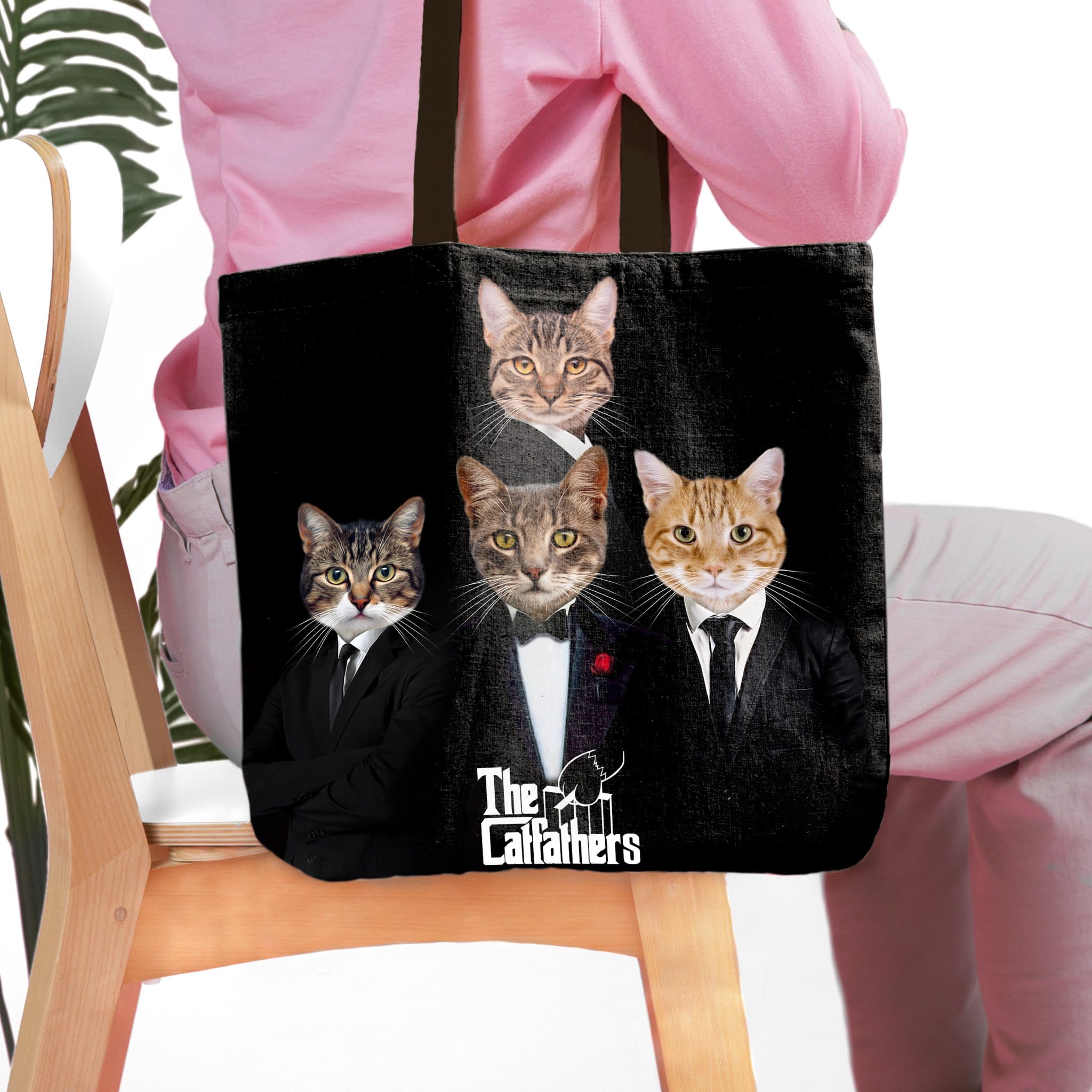 Personalized black tote bag with four custom cat portraits in "The Catfathers" renaissance style.