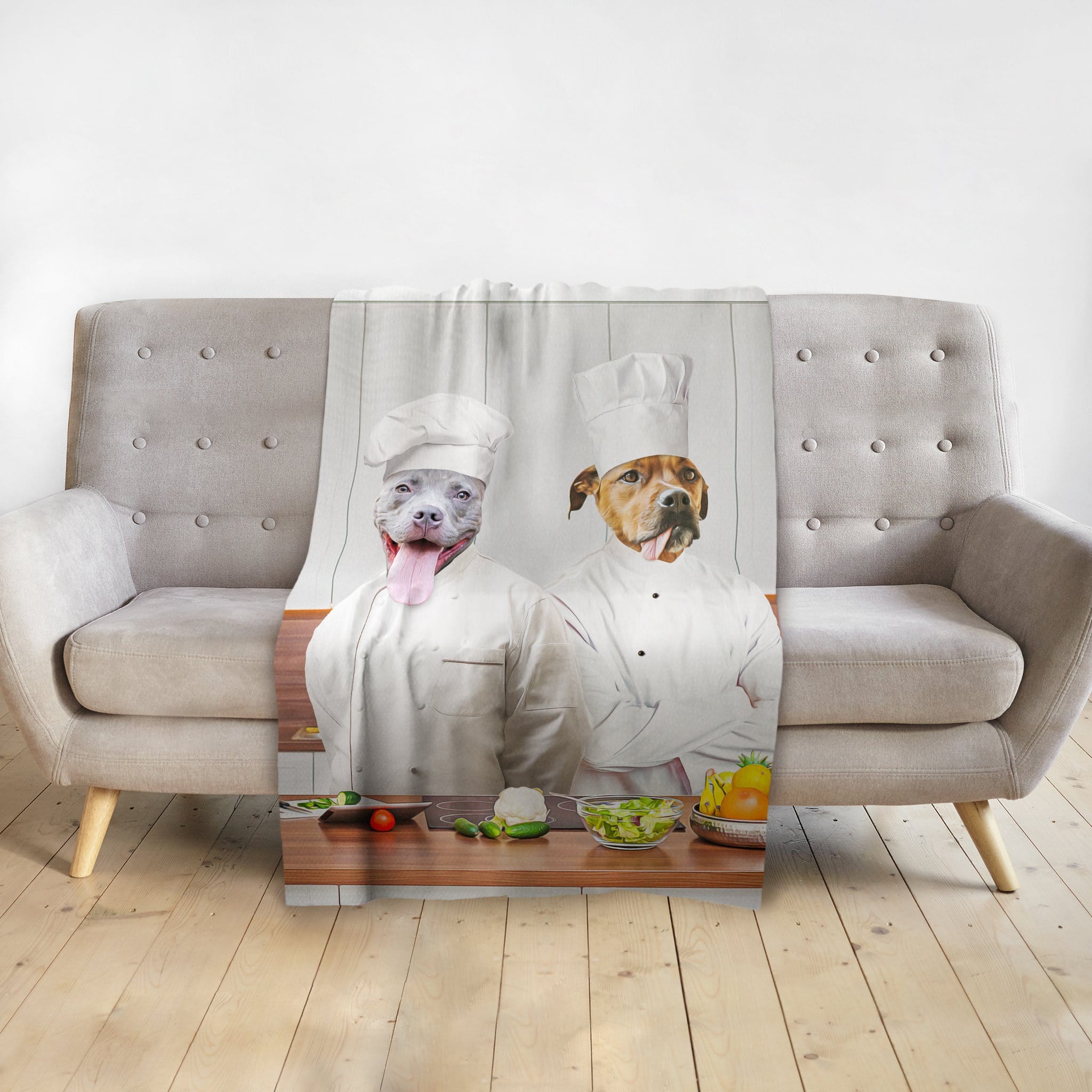 Personalized 2 pet blanket featuring dogs as chefs, draped over a light gray sofa.