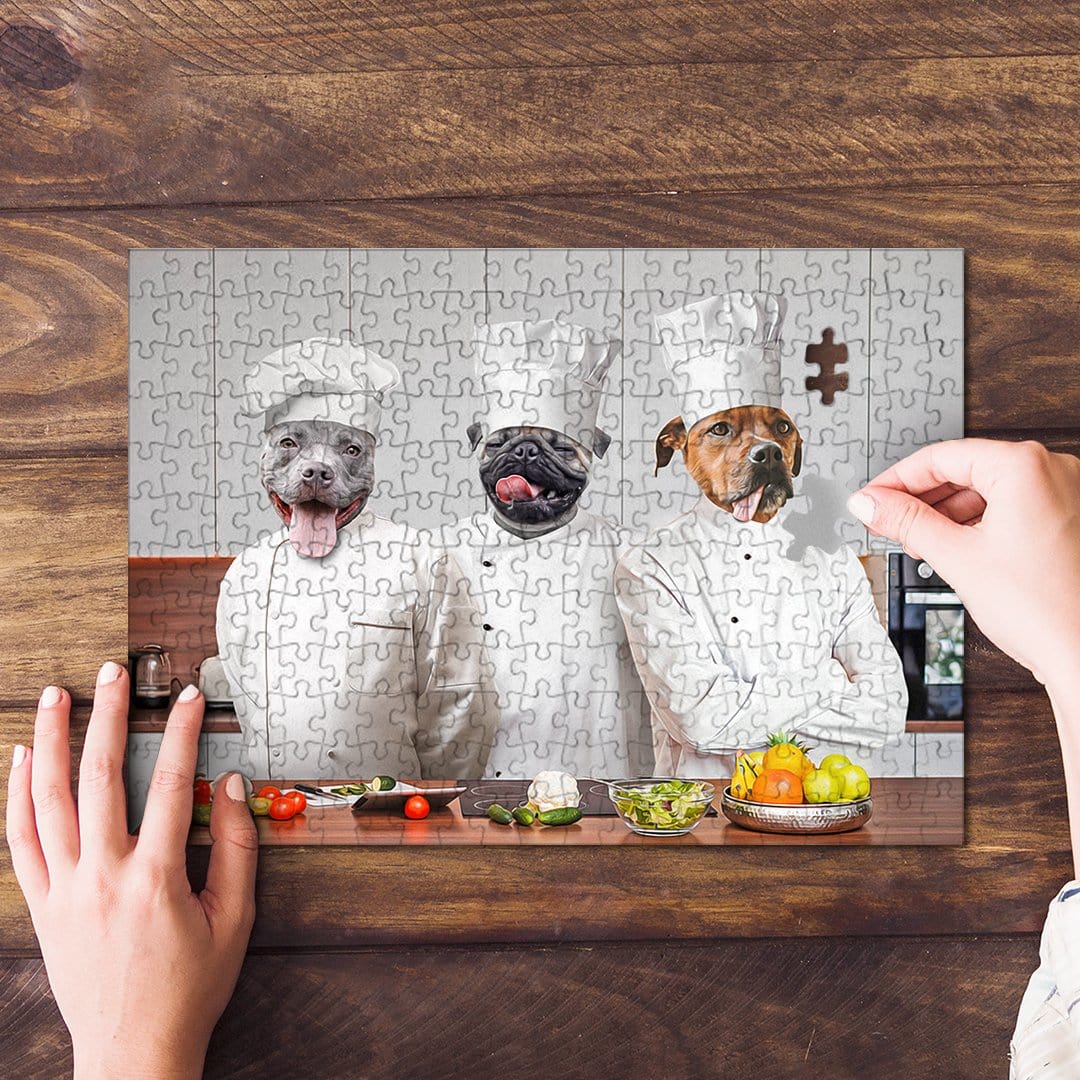 Personalized 3-pet puzzle featuring dogs as chefs, with a hand placing the last piece.
