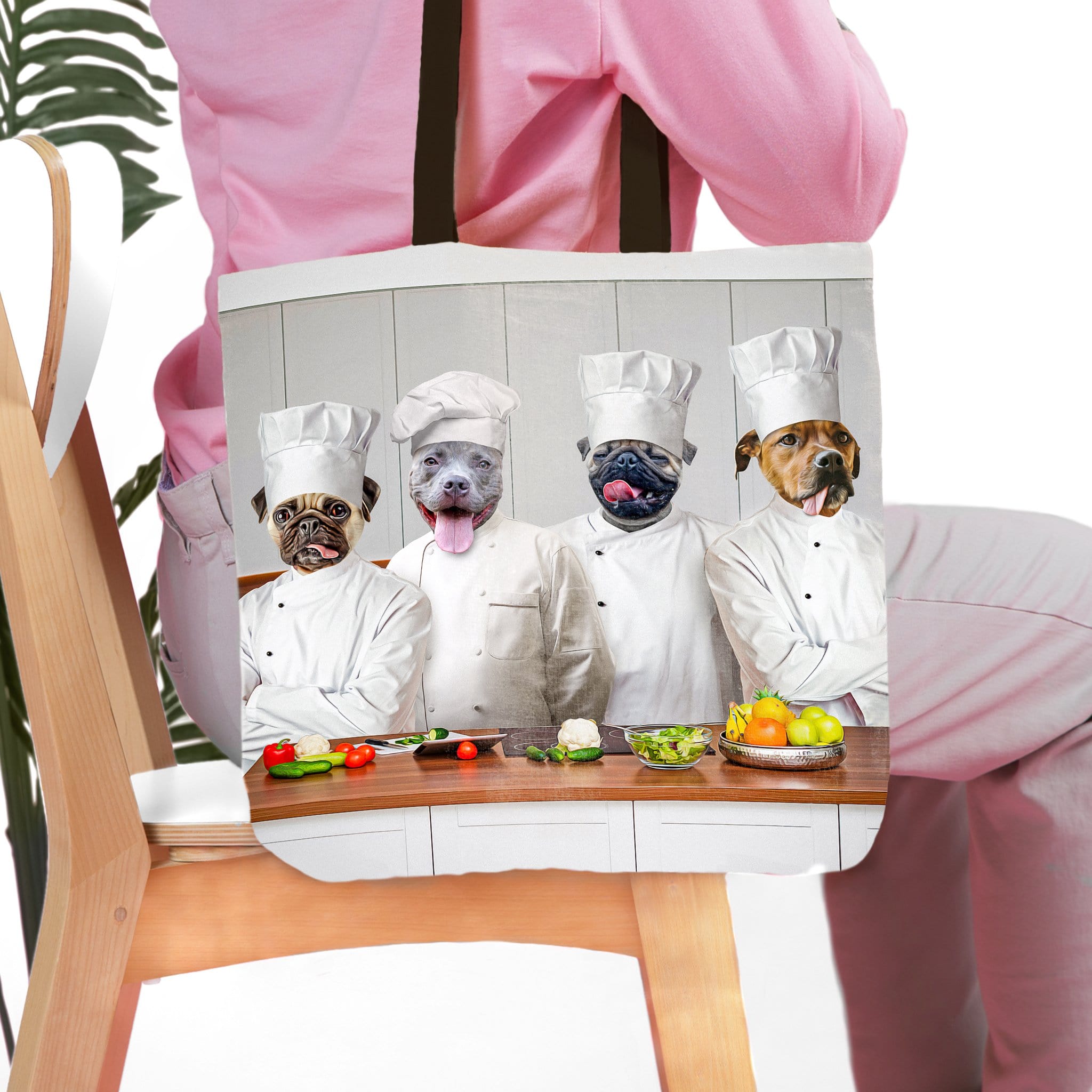 Personalized white canvas tote bag with four custom pet portraits as chefs in a kitchen.