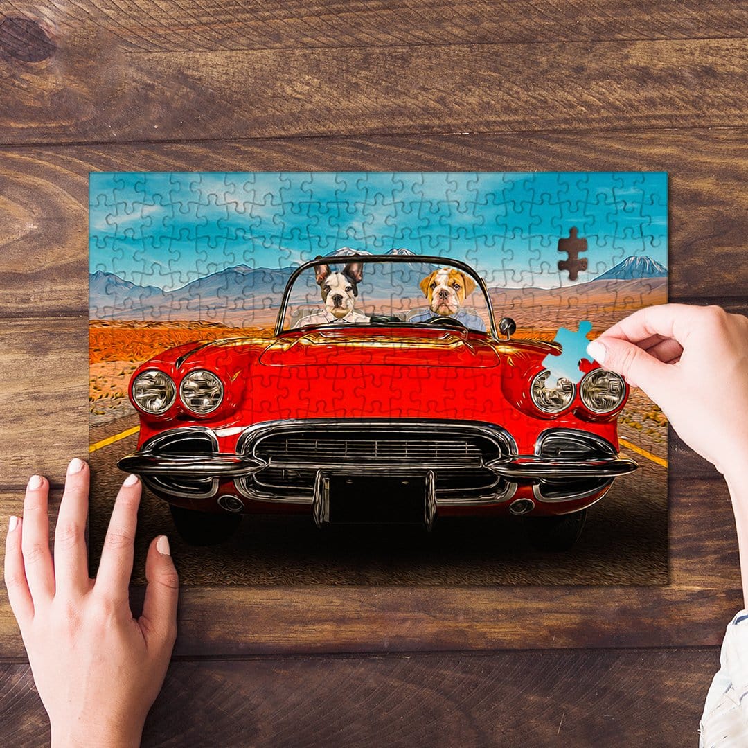 Personalized 2-pet puzzle featuring two dogs in a red classic car, with a hand placing a piece.