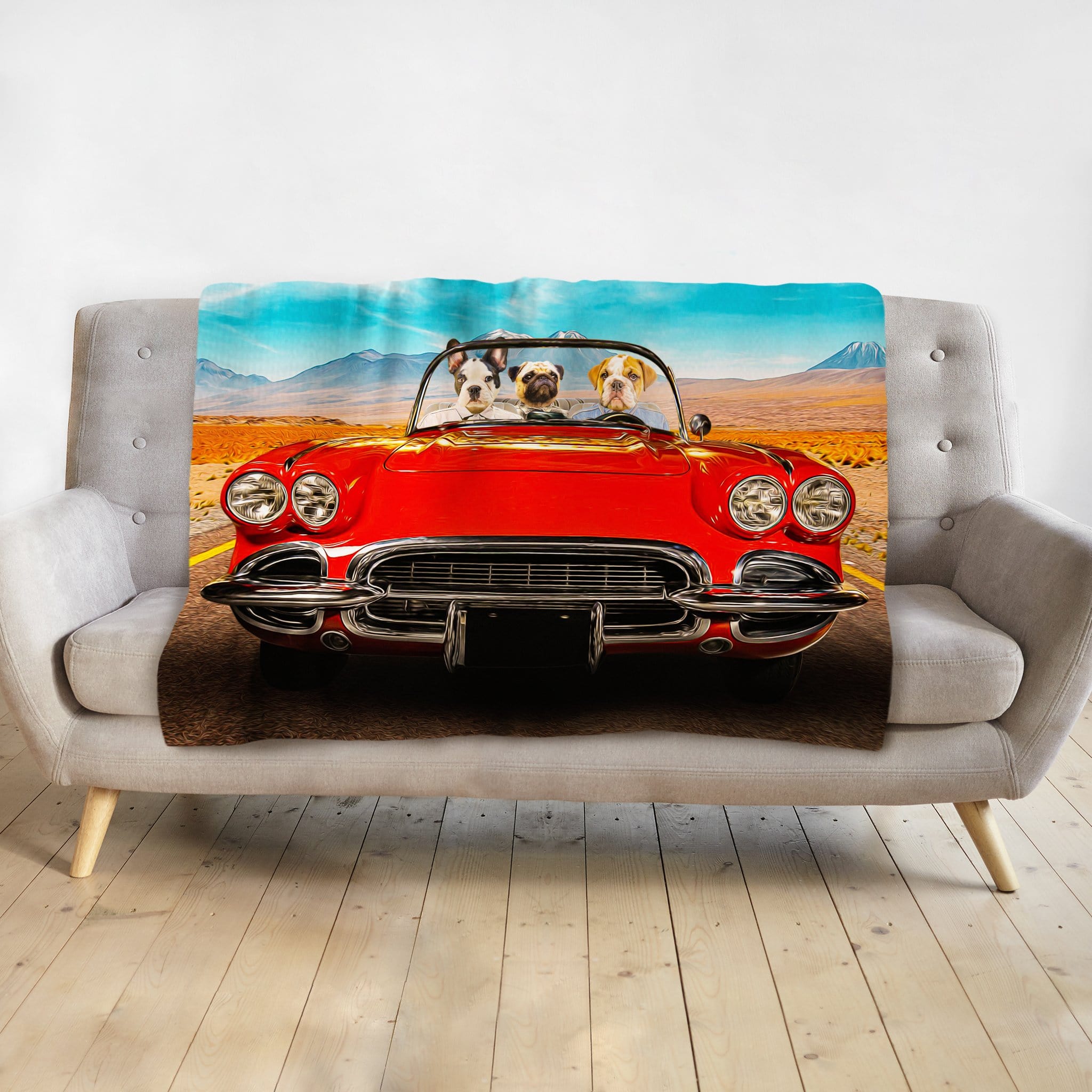 Personalized pet portrait blanket featuring three dogs in a red classic car on a desert road.