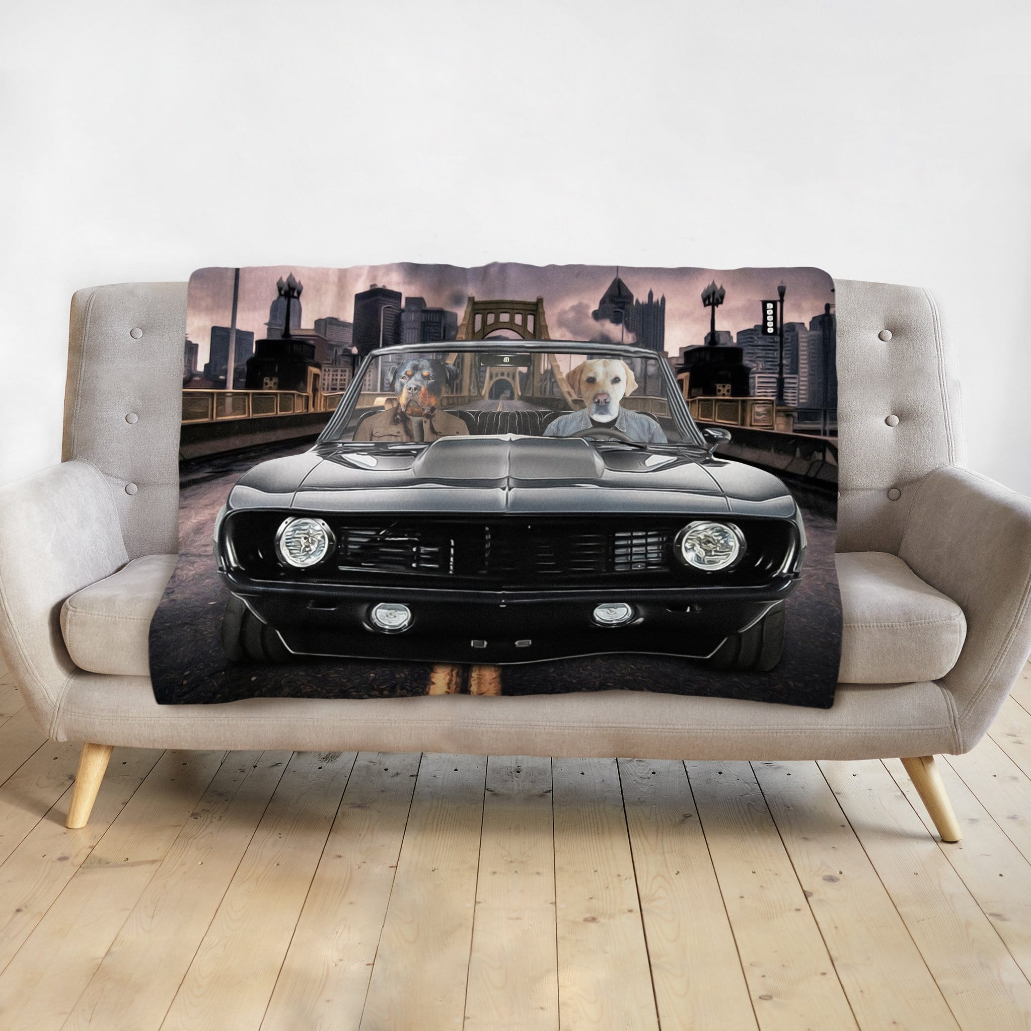 Personalized pet portrait blanket featuring two dogs in a black classic car with a city skyline.