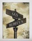Personalized 'The Day We Met' poster featuring two street signs with names "GUS" and "REBECCA" and date "11-11-2021" on a vintage-style background.