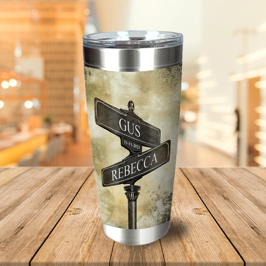 Personalized stainless steel tumbler with a street sign design featuring "Gus" and "Rebecca" and the date "11-11-2021".