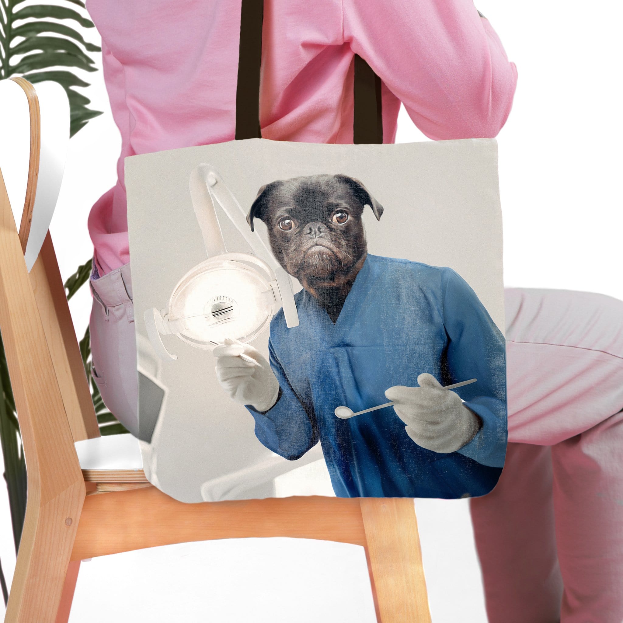 Personalized tote bag with a custom pet portrait of a pug dressed as a dentist in blue scrubs.