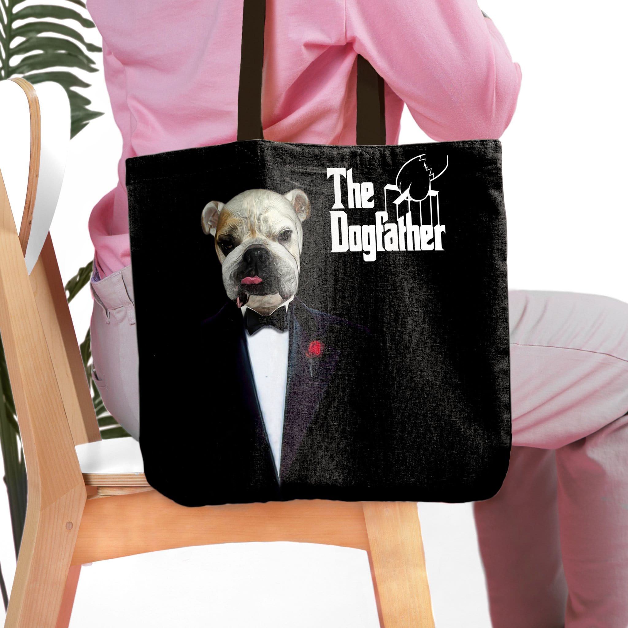 Black personalized tote bag with a custom bulldog pet portrait in a tuxedo, "The Dogfather" text.