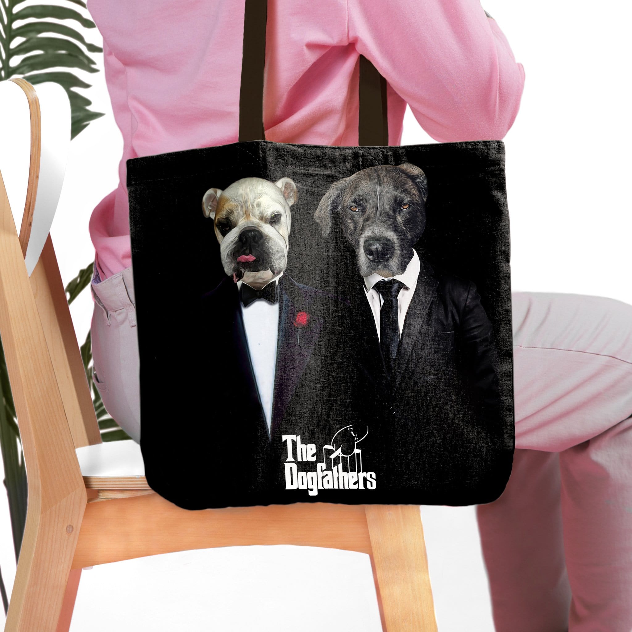 Personalized black tote bag with two custom dog portraits dressed in "The Dogfathers" style suits.