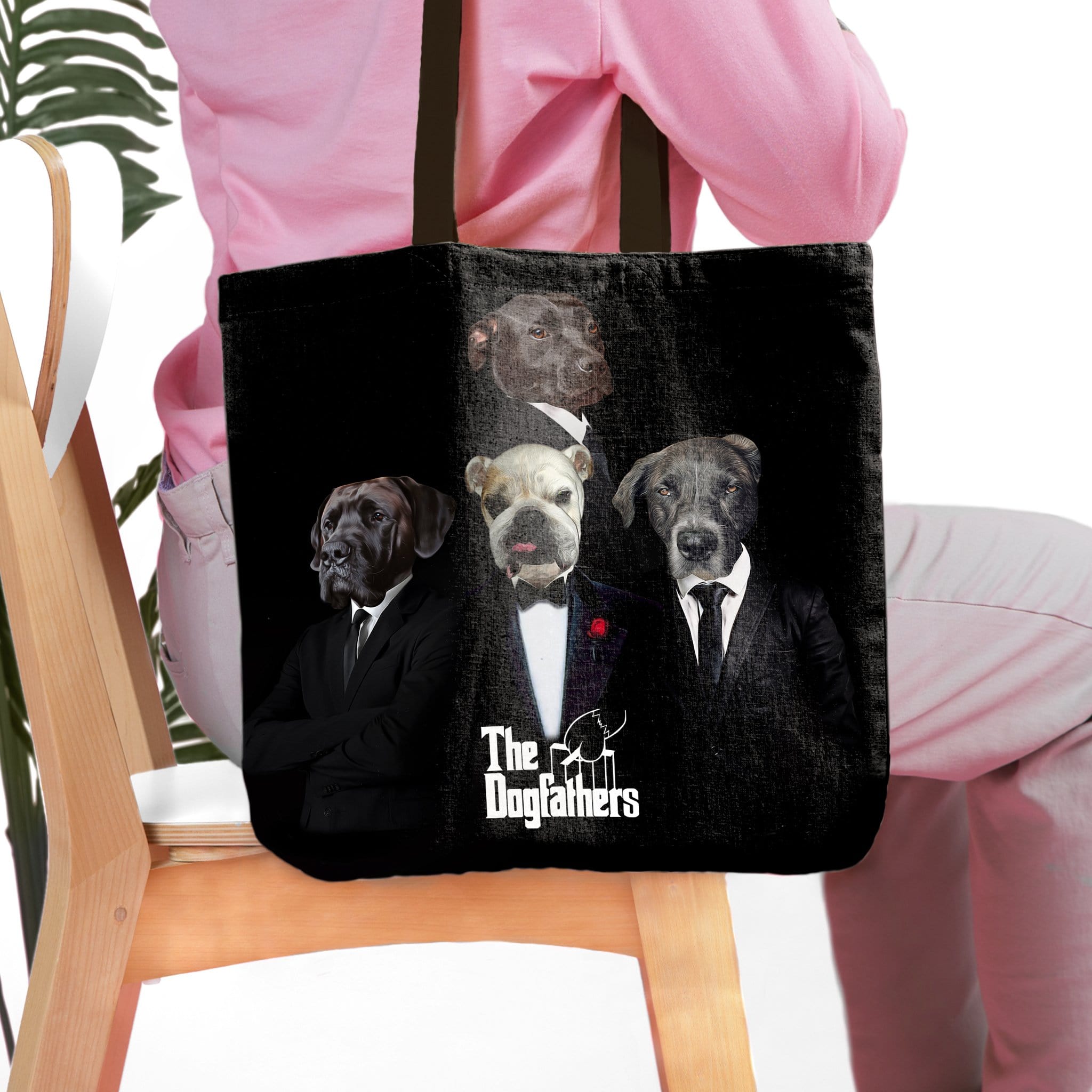 Black personalized "The Dogfathers" tote bag with four custom pet portraits in suits.