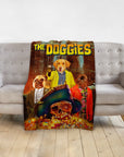 Personalized 'The Doggies' blanket featuring three pet portraits in a movie poster style.