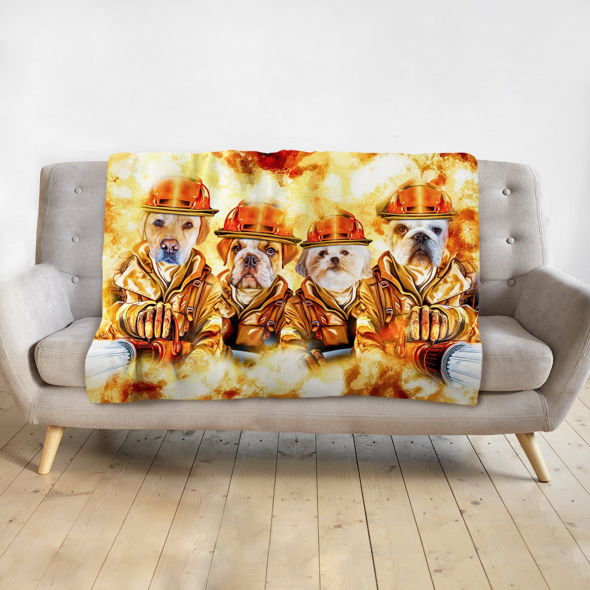 Personalized minky blanket with four dogs as firefighters in a watercolor portrait style on a light gray couch.