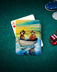 Personalized playing cards featuring two dogs in a boat, with an ace of hearts, dice, and poker chips on a green table.