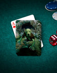 Custom pet portrait playing cards featuring a dog's face on a green goblin body, with poker chips and dice.