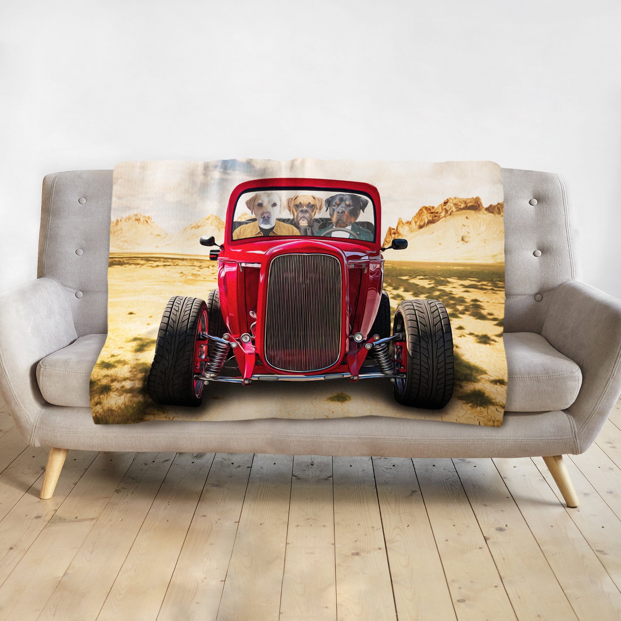 Personalized 3 pet blanket, cartoon dogs in a red hot rod, desert background, on a gray sofa.