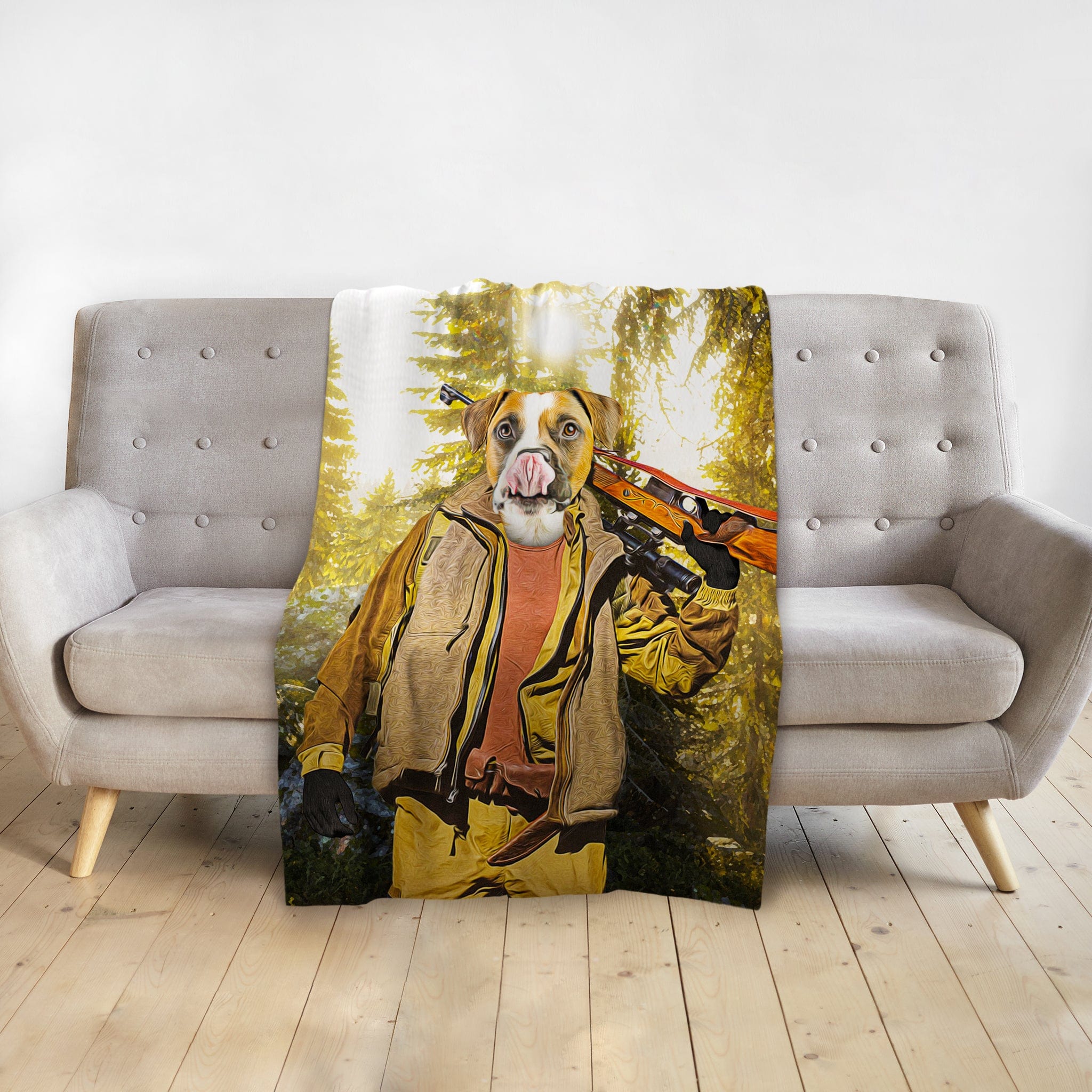 Personalized pet blanket with a boxer dog in a hunter portrait, draped over a gray sofa.