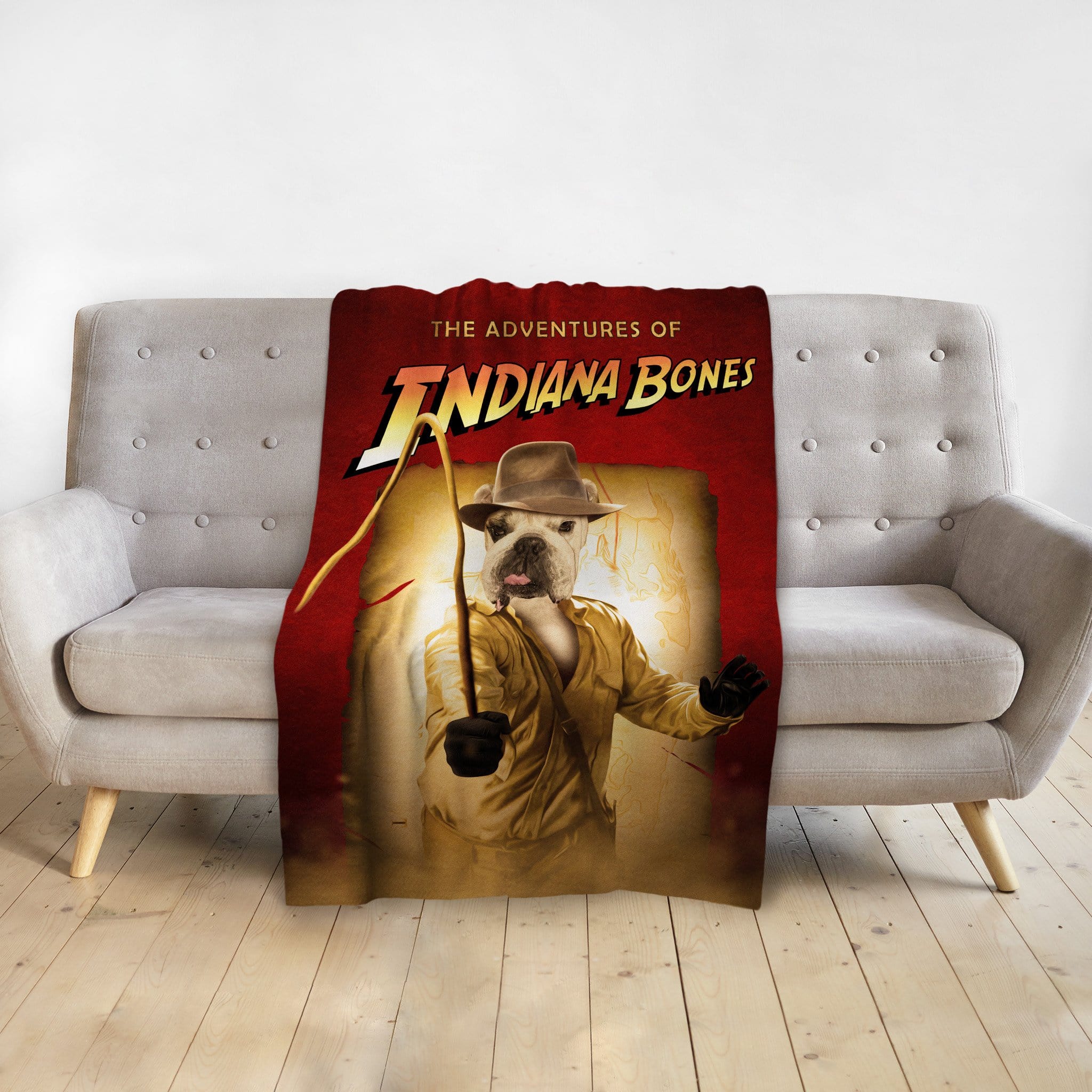 Personalized pet blanket with a French Bulldog in an Indiana Jones-style portrait, red background.