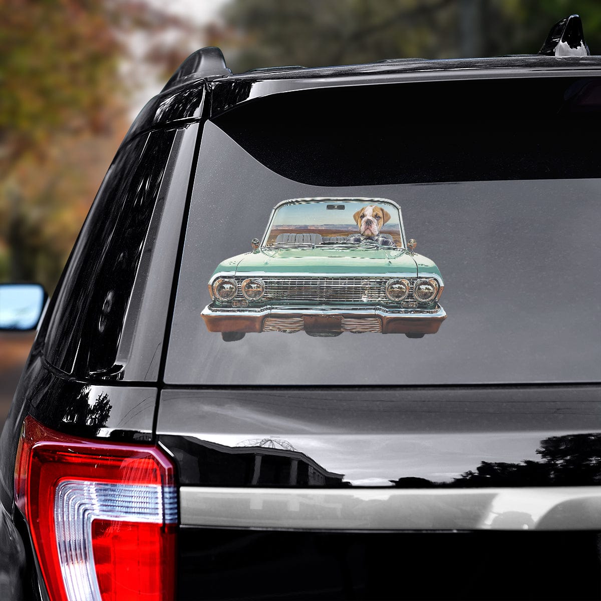 Custom pet decal of a dog driving a green lowrider car on a black SUV window.