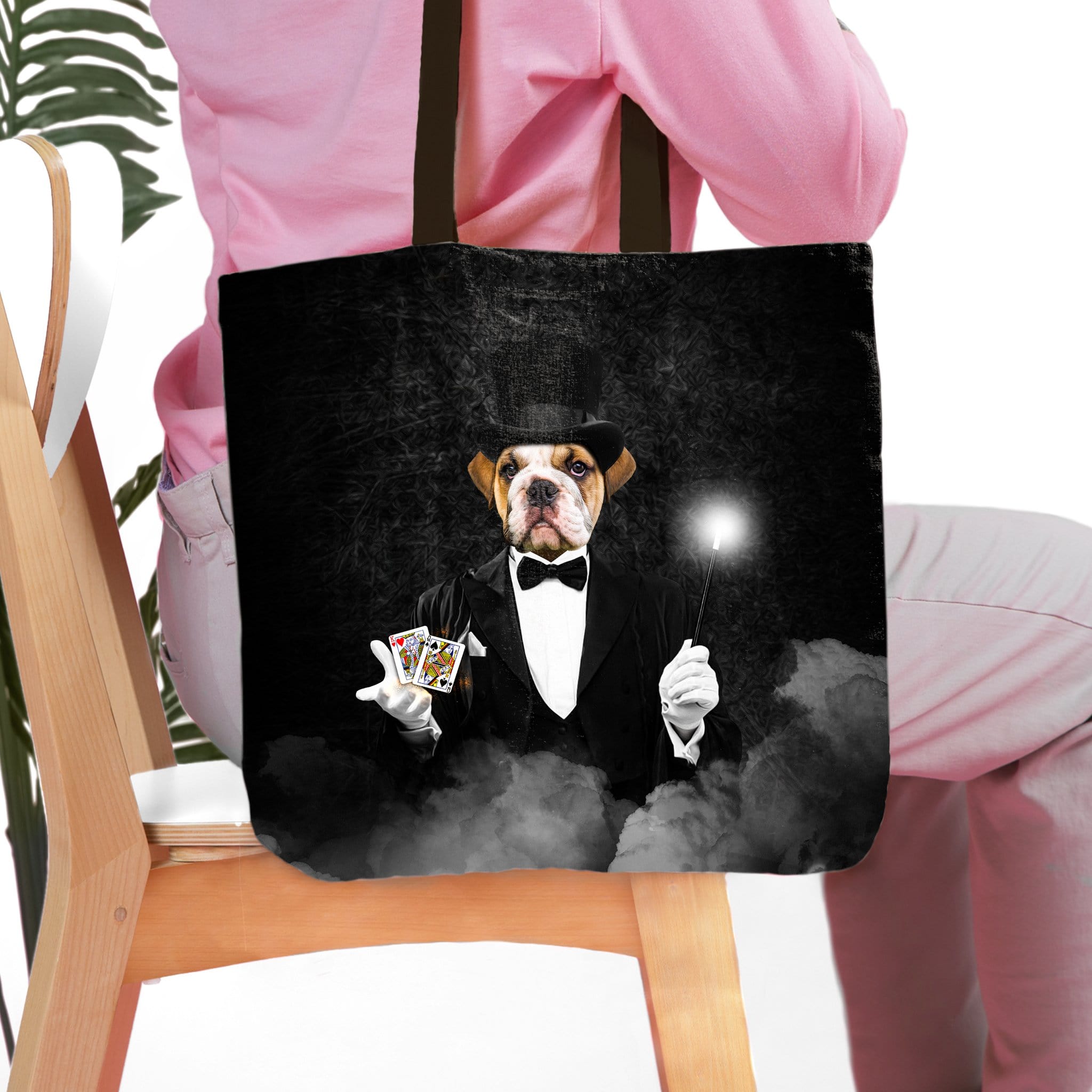 Personalized black tote bag with a custom pet portrait of a bulldog as a magician.